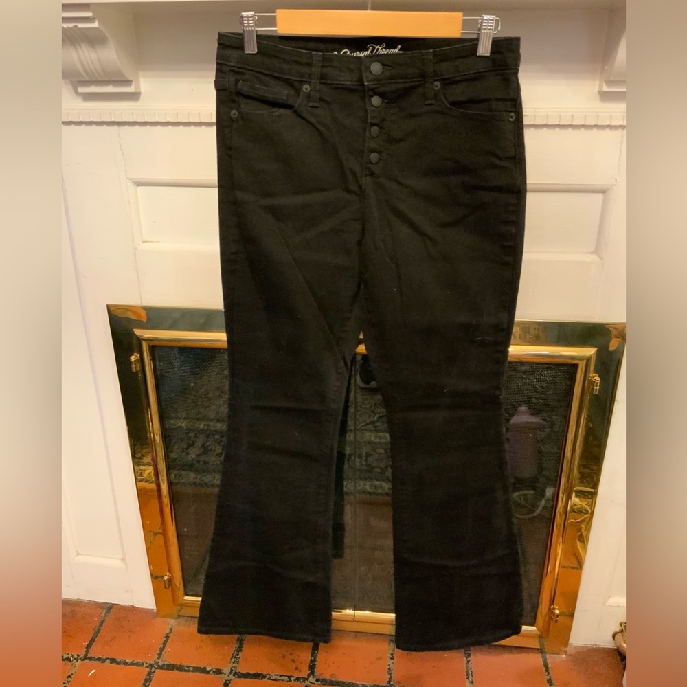 Universal Thread black jeans with visible button fly.